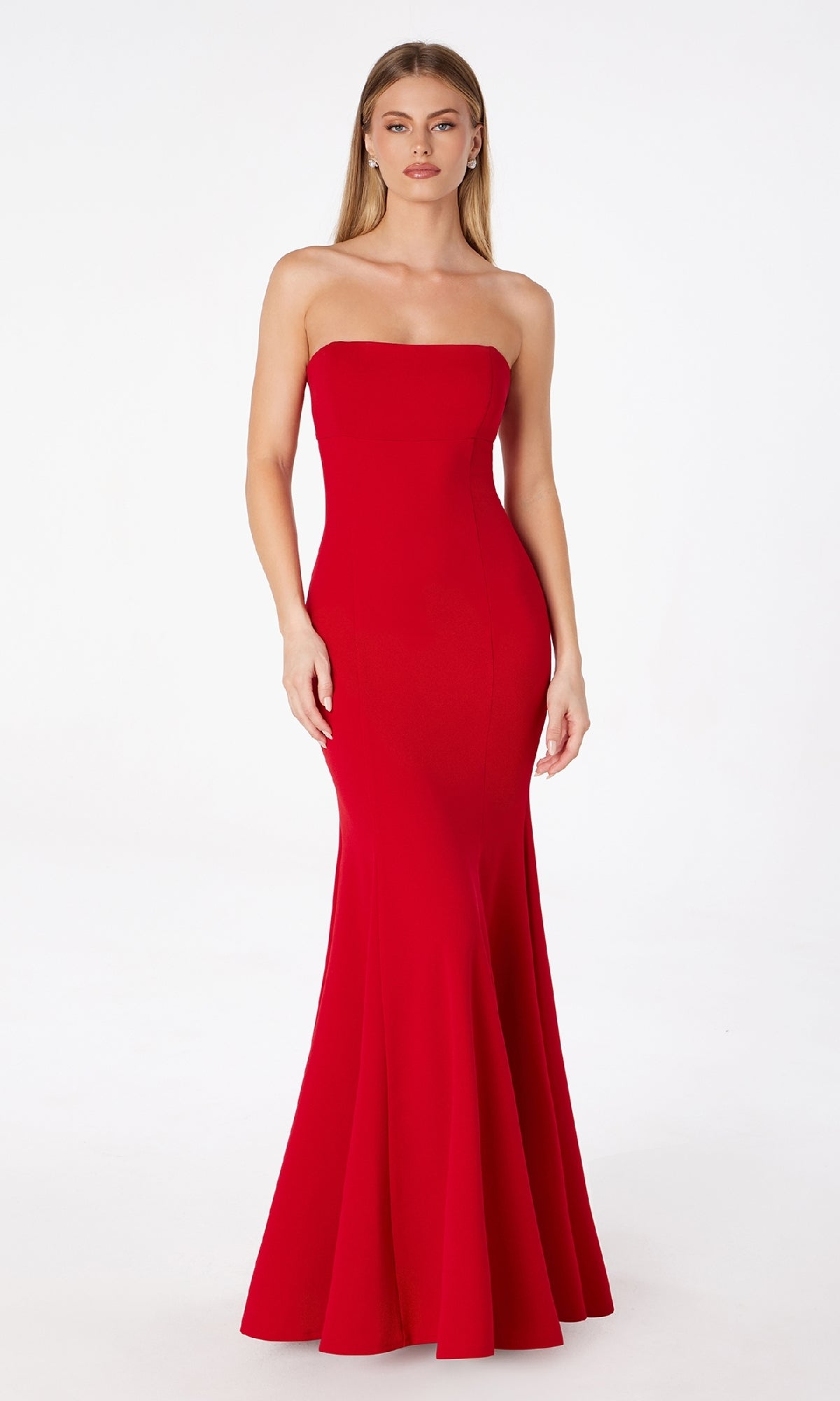 A woman models the Lace-Up Strapless Long Prom Dress: Astee T2010, featuring a fitted bodice and flared skirt in red, standing against a plain white background.